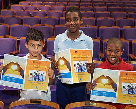 students hold study guide books at the broward center